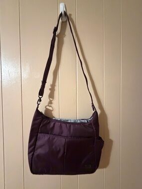 PacSafe purple day safe cross body travel purse